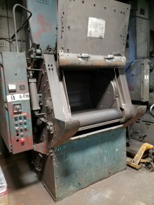 Looking inside tumble blast machine